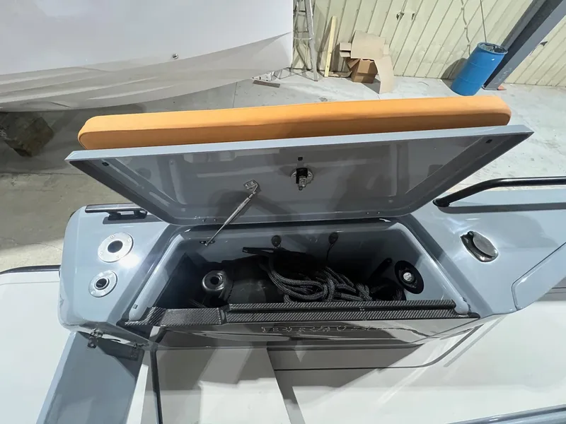 Slide: The Image of 2024 BRABUS Shadow 900 XC Cross Cabin storage compartment open, showcasing interior features. - 16