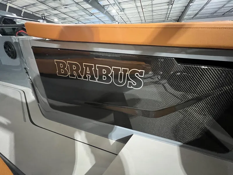 Slide: The Image of 2024 BRABUS Shadow 900 XC Cross Cabin with sleek carbon fiber detailing. - 17