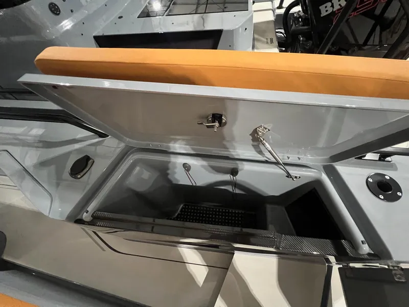 Slide: The Image of 2024 BRABUS Shadow 900 XC Cross Cabin storage compartment with open lid. - 18