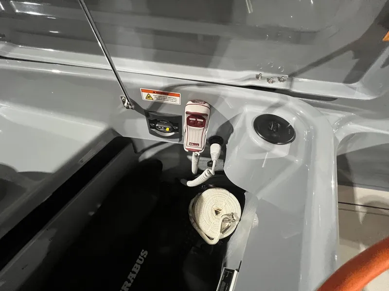 Slide: The Image of 2024 BRABUS Shadow 900 XC Cross Cabin interior detail with control panel and rope storage. - 21