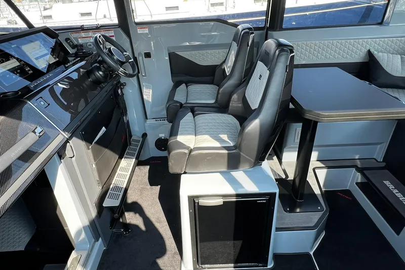 Slide: The Image of 2024 BRABUS Shadow 900 XC Cross Cabin interior with luxury seating and modern dashboard. - 29