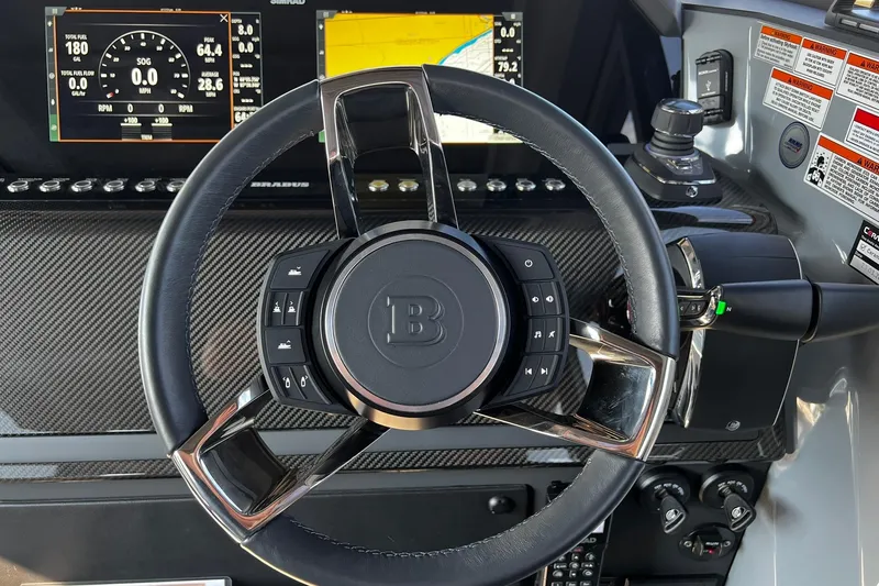 Slide: The Image of Steering wheel of 2024 BRABUS Shadow 900 XC Cross Cabin with digital dashboard display. - 31