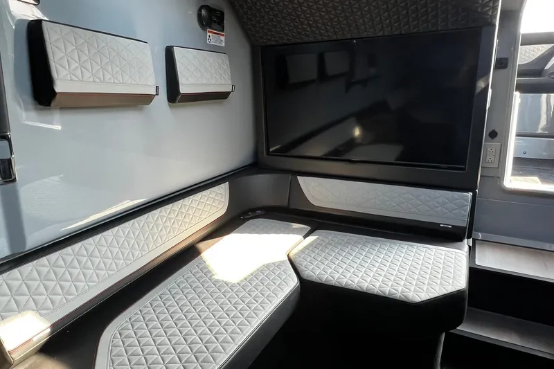 Slide: The Image of Luxurious interior of 2024 BRABUS Shadow 900 XC Cross Cabin with quilted seating and large screen. - 37