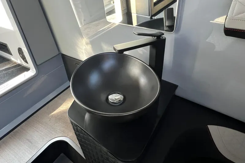 Slide: The Image of Modern black sink in 2024 BRABUS Shadow 900 XC Cross Cabin interior. - 38