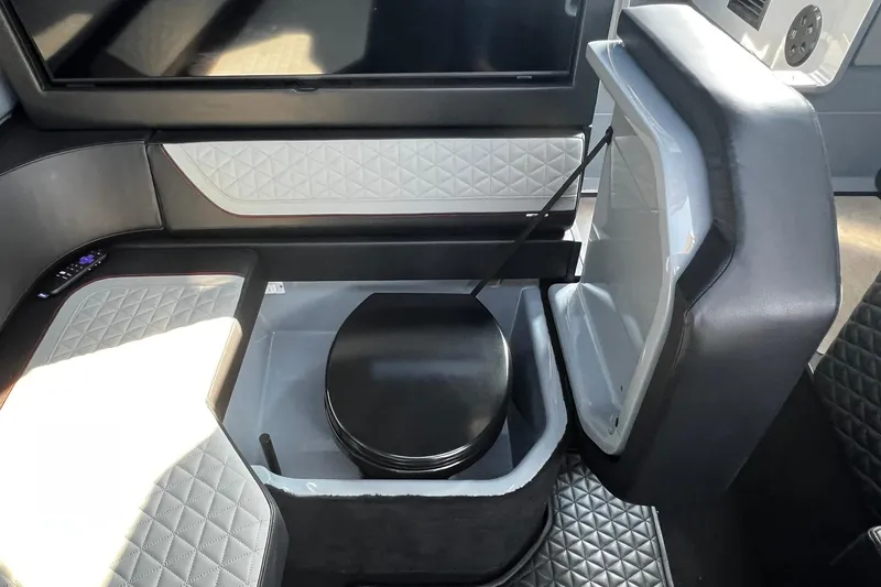 Slide: The Image of 2024 BRABUS Shadow 900 XC Cross Cabin interior with luxury seating and storage compartment. - 41