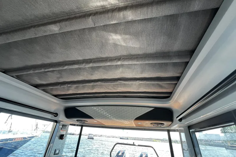 Slide: The Image of 2024 BRABUS Shadow 900 XC Cross Cabin interior roof view with water backdrop. - 45