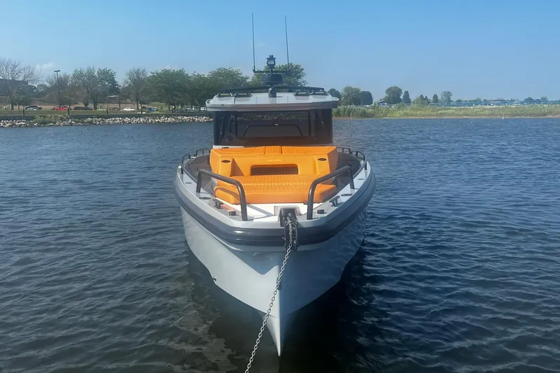 Slide: The Image of 2024 BRABUS Shadow 900 XC Cross Cabin boat docked on calm water. - 9