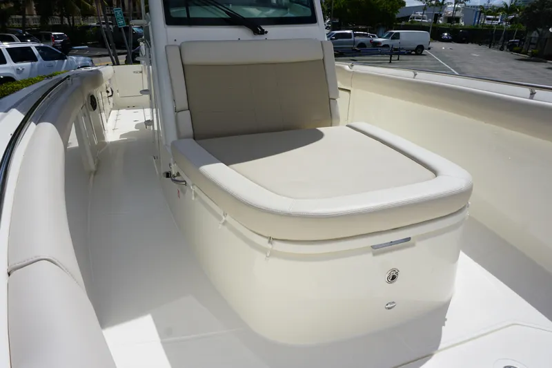 Slide: The Image of 2026 Boston Whaler 330 Outrage boat interior with cushioned seating. - 25