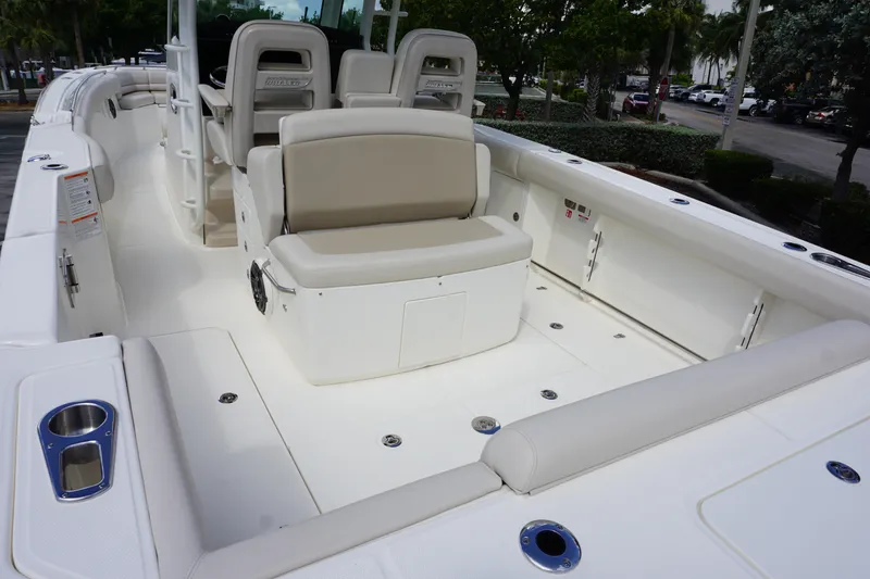 Slide: The Image of 2026 Boston Whaler 330 Outrage boat interior with seating and storage compartments. - 6
