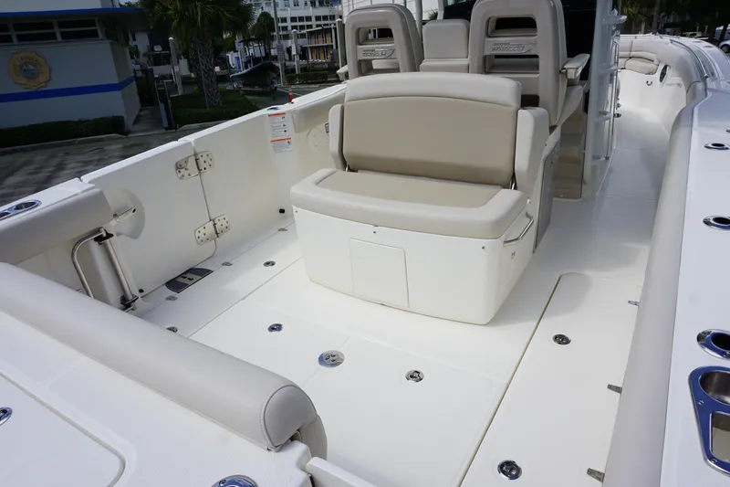 Slide: The Image of 2026 Boston Whaler 330 Outrage boat interior with seating and deck view. - 7