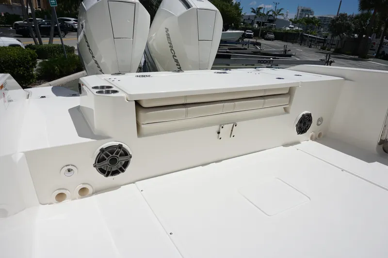 Slide: The Image of 2026 Boston Whaler 280 Dauntless boat deck with seating and Mercury engines. - 10