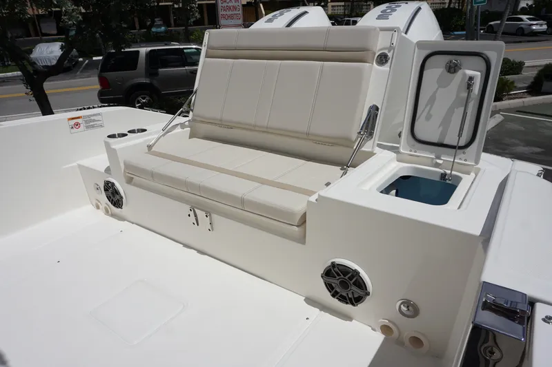 Slide: The Image of 2026 Boston Whaler 280 Dauntless boat interior with seating and storage compartments. - 11
