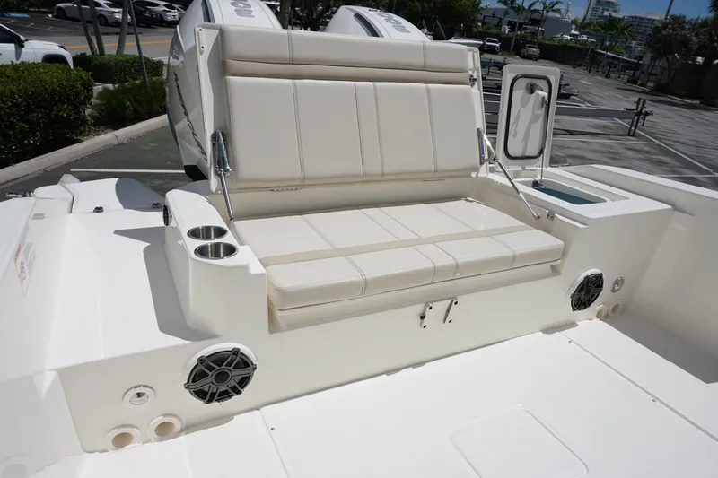Slide: The Image of 2026 Boston Whaler 280 Dauntless boat interior with seating and cup holders. - 12