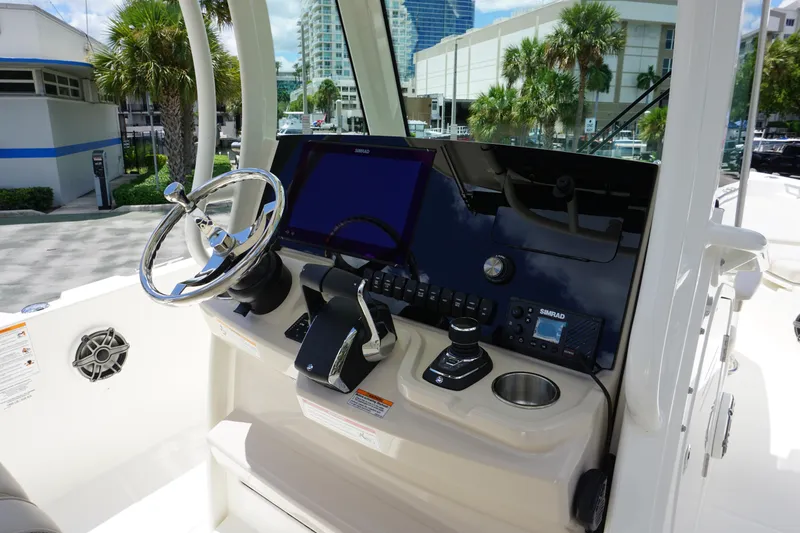 Slide: The Image of 2026 Boston Whaler 280 Dauntless helm with modern controls and navigation system. - 20