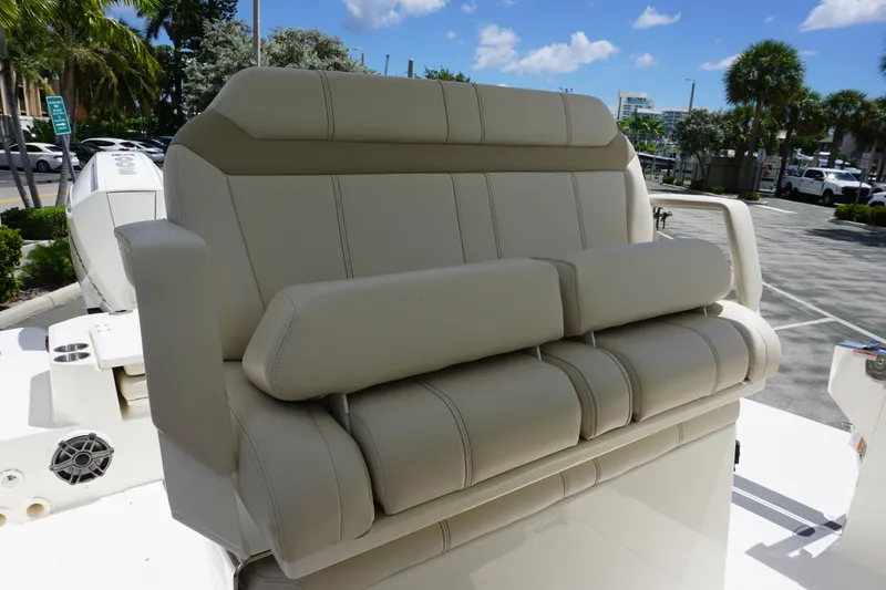 Slide: The Image of 2026 Boston Whaler 280 Dauntless boat seat, beige upholstery, outdoor setting. - 22
