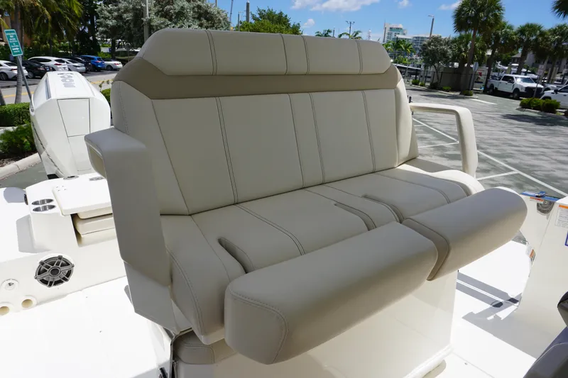 Slide: The Image of 2026 Boston Whaler 280 Dauntless boat seating, featuring luxurious beige upholstery. - 24