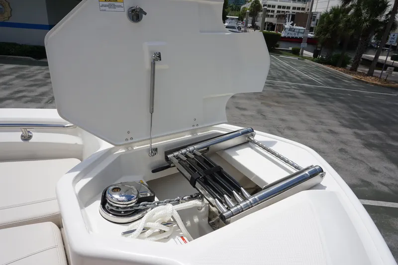 Slide: The Image of 2026 Boston Whaler 280 Dauntless boat ladder and anchor storage compartment. - 32