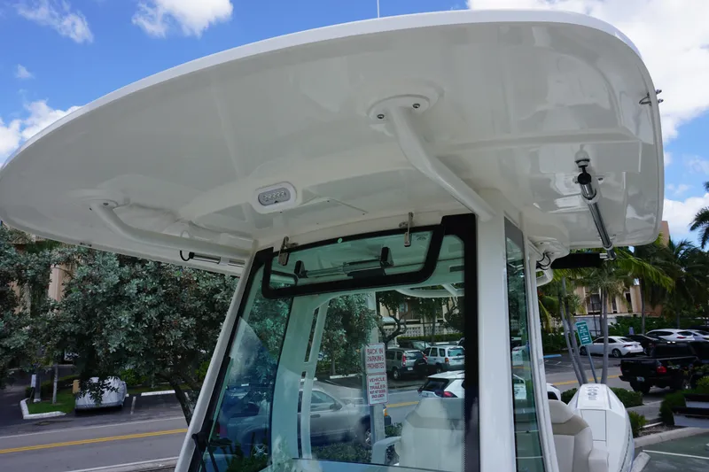Slide: The Image of 2026 Boston Whaler 280 Dauntless boat canopy and console, showcasing sleek design. - 38