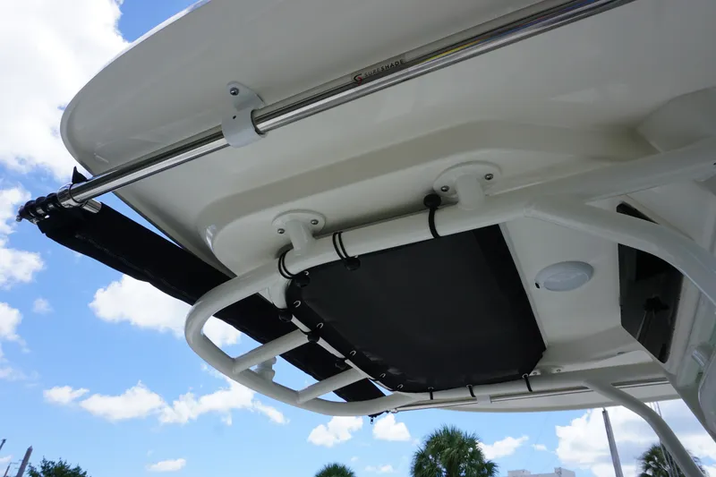 Slide: The Image of 2026 Boston Whaler 280 Dauntless boat canopy and support structure under blue sky. - 40
