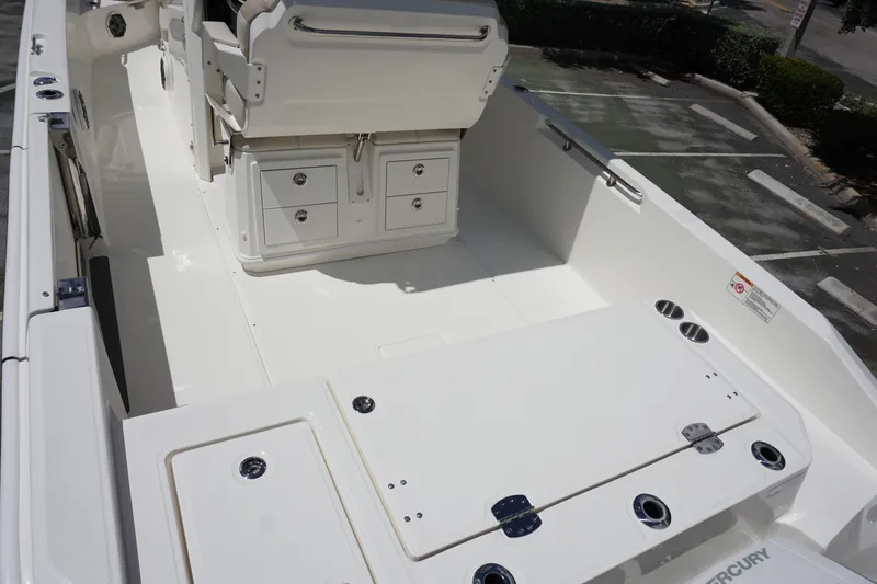 Slide: The Image of 2026 Boston Whaler 280 Dauntless boat interior with seating and storage compartments. - 7