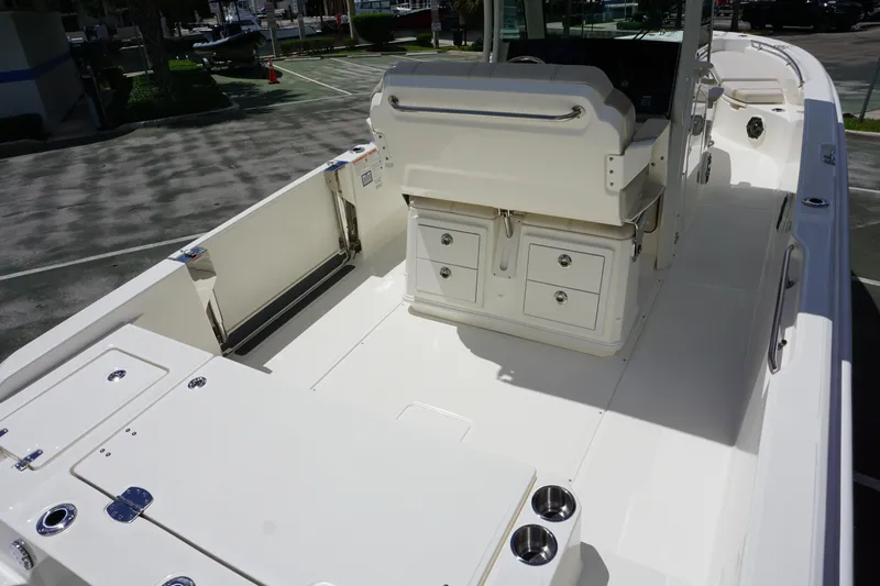 Slide: The Image of 2026 Boston Whaler 280 Dauntless boat interior with seating and storage compartments. - 8