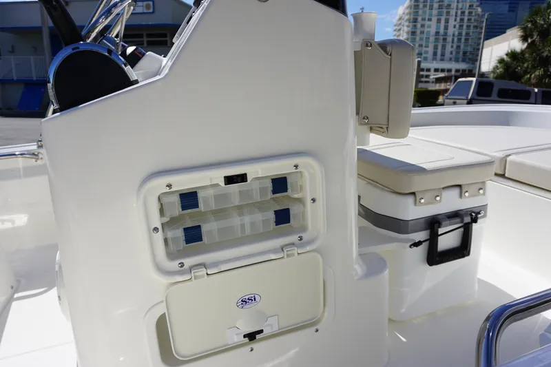Slide: The Image of 2025 Boston Whaler 150 Montauk boat interior with storage compartments and seating. - 12