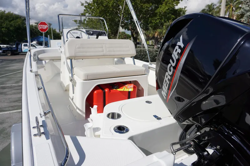 Slide: The Image of 2025 Boston Whaler 150 Montauk boat with Mercury engine, interior view. - 16