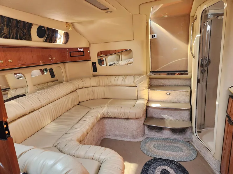 Slide: The Image of Luxurious interior of 2000 Sea Ray 370 Express Cruiser with plush seating and elegant design. - 11