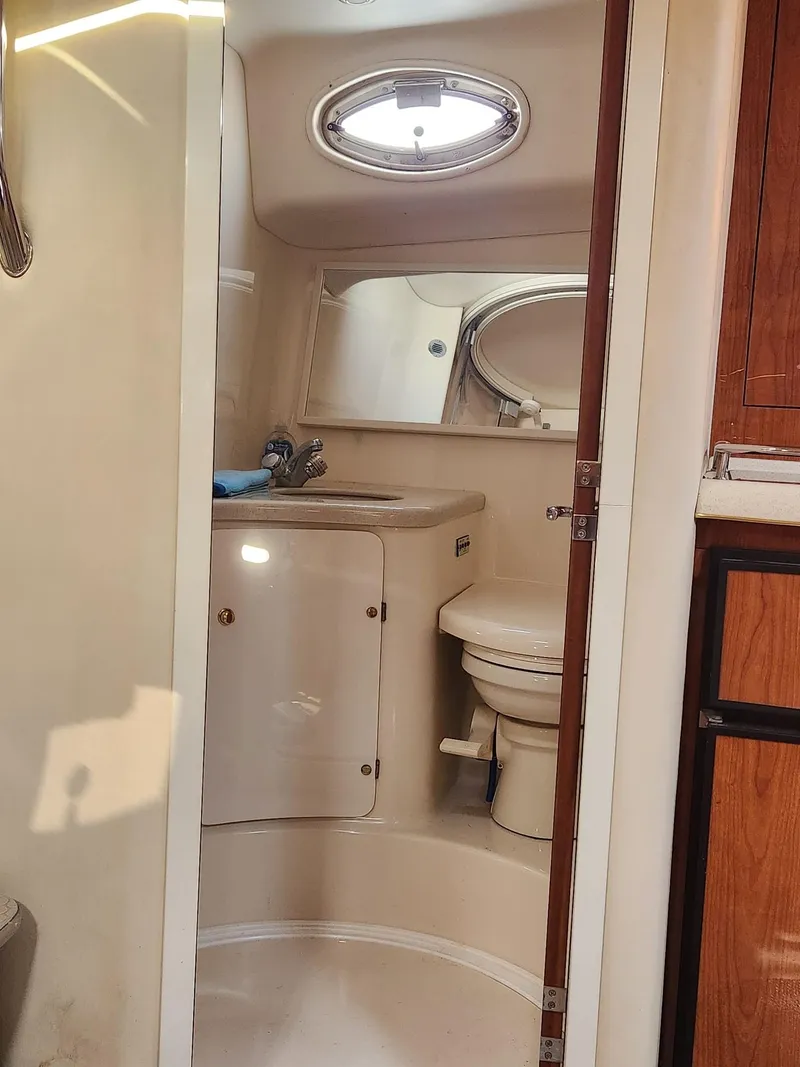 Slide: The Image of Bathroom interior of 2000 Sea Ray 370 Express Cruiser with sink and toilet. - 17