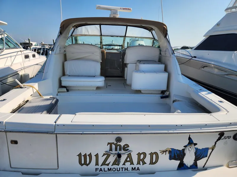 Slide: The Image of 2000 Sea Ray 370 Express Cruiser named "The Wizard" docked in Falmouth, MA. - 2