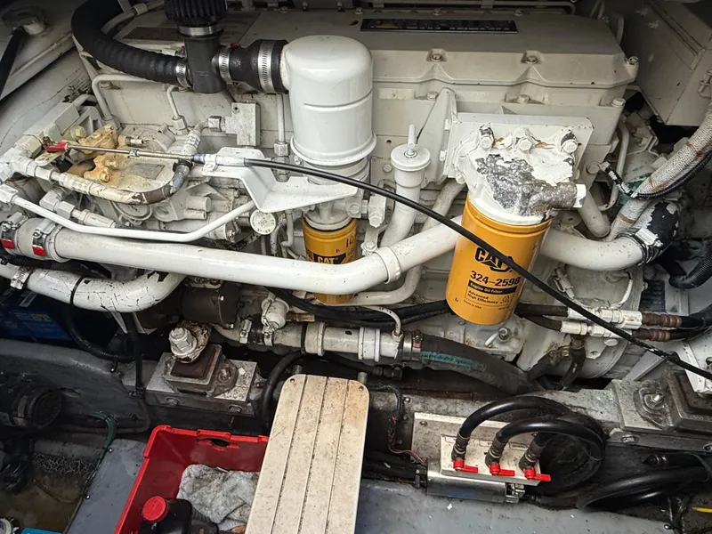 Slide: The Image of Engine compartment of a 2000 Sea Ray 370 Express Cruiser with visible components. - 20