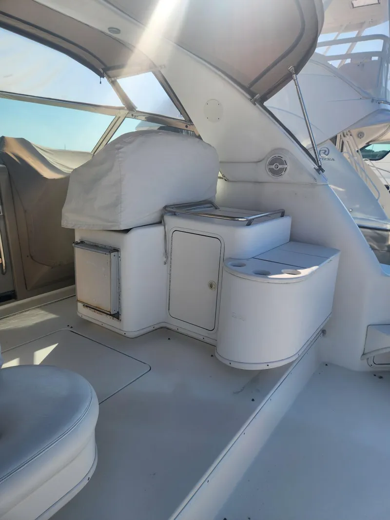 Slide: The Image of 2000 Sea Ray 370 Express Cruiser interior with seating and storage. - 5