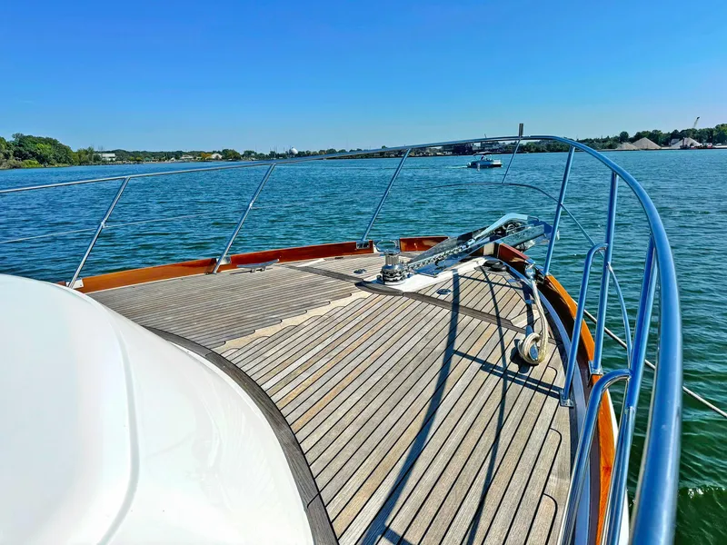 Slide: The Image of 2014 Grand Banks 46 Eastbay FB yacht deck overlooking serene waters. - 11