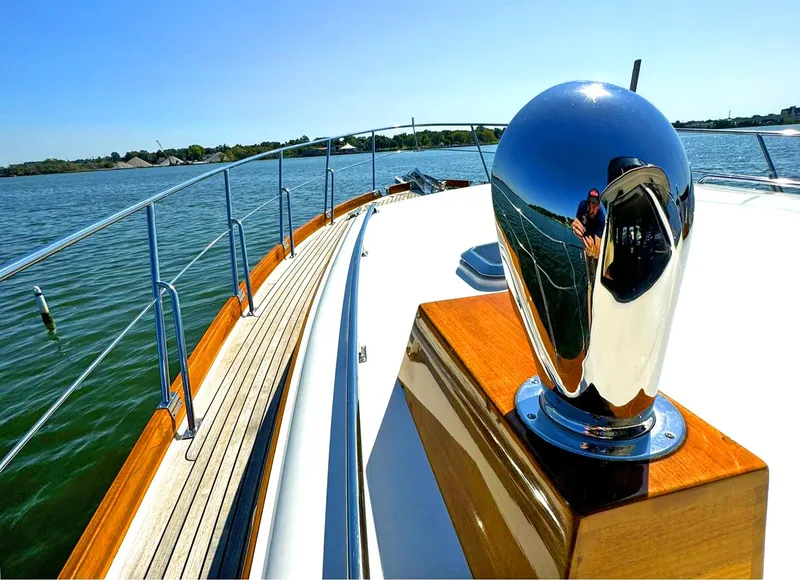 Slide: The Image of 2014 Grand Banks 46 Eastbay FB yacht deck with polished metal details on a sunny day. - 14