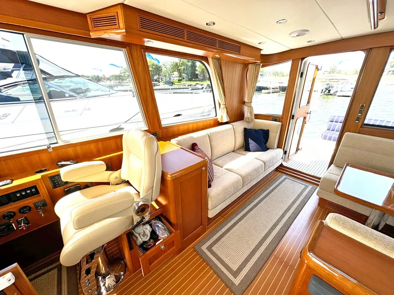 Slide: The Image of Luxurious interior of 2014 Grand Banks 46 Eastbay FB yacht with plush seating and wood finishes. - 28
