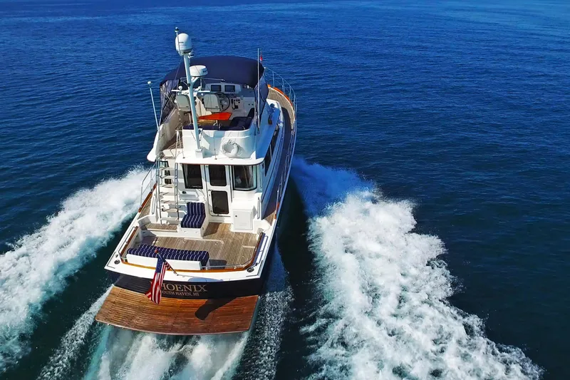 Slide: The Image of 2014 Grand Banks 46 Eastbay FB cruising on open blue waters. - 3