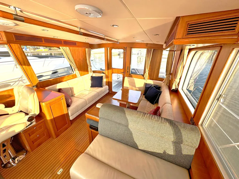 Slide: The Image of Luxurious interior of 2014 Grand Banks 46 Eastbay FB yacht with elegant seating and wood finishes. - 31