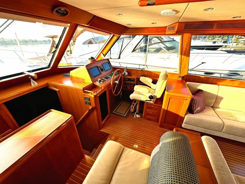 Slide: The Image of Luxurious 2014 Grand Banks 46 Eastbay FB yacht interior with wood finish and plush seating. - 32