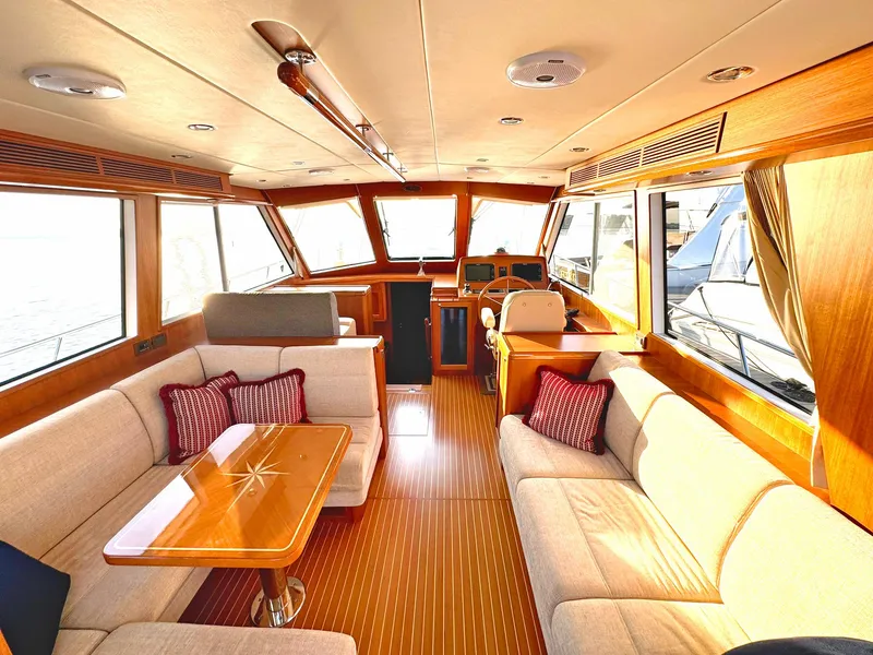 Slide: The Image of Luxurious interior of 2014 Grand Banks 46 Eastbay FB yacht with elegant seating and wooden finishes. - 33