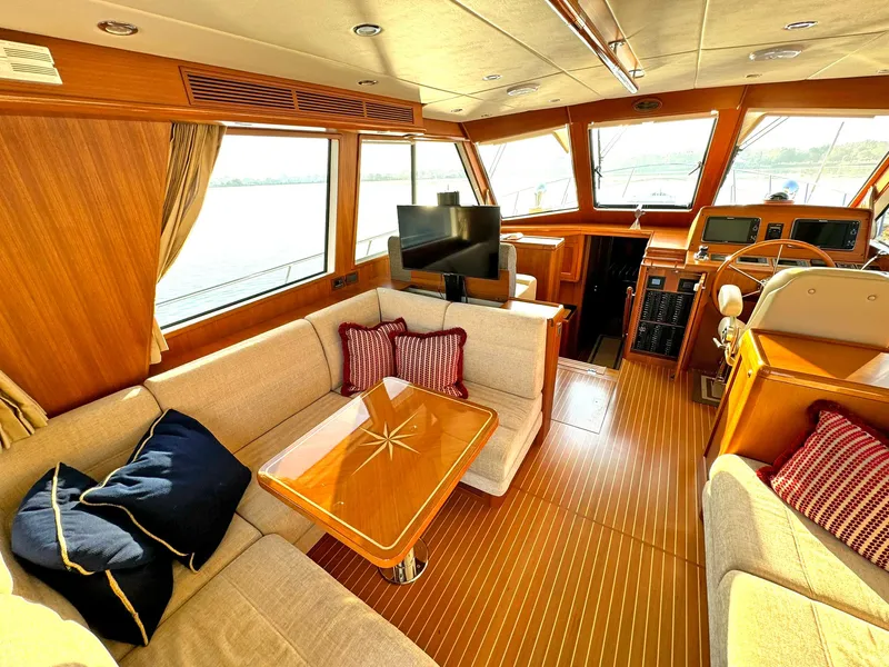 Slide: The Image of Luxurious interior of 2014 Grand Banks 46 Eastbay FB yacht with elegant seating and helm. - 34