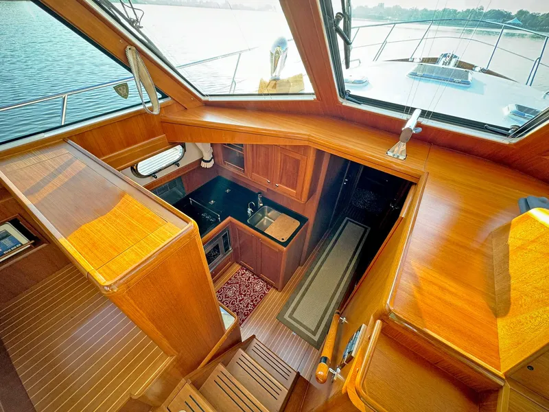 Slide: The Image of Luxurious 2014 Grand Banks 46 Eastbay FB yacht interior with wood finish and modern amenities. - 37
