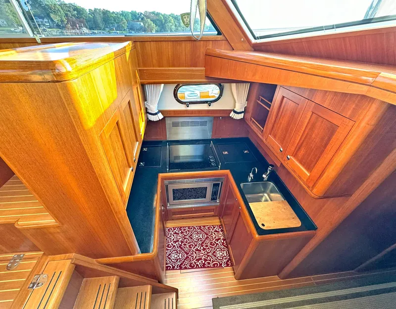 Slide: The Image of Luxurious wooden kitchen interior of 2014 Grand Banks 46 Eastbay FB yacht. - 38