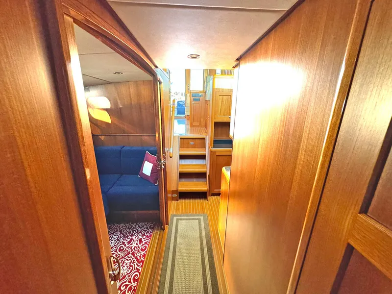 Slide: The Image of Interior of 2014 Grand Banks 46 Eastbay FB yacht with wooden finish and cozy seating area. - 39