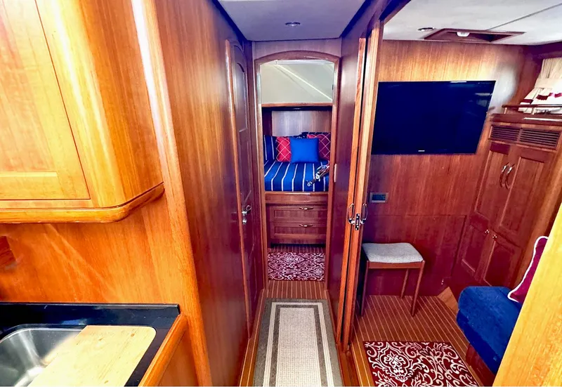 Slide: The Image of Luxurious interior of 2014 Grand Banks 46 Eastbay FB yacht with wood finish and cozy furnishings. - 43