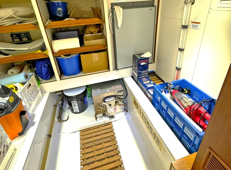 Slide: The Image of Storage area on a 2014 Grand Banks 46 Eastbay FB with shelves and equipment. - 45