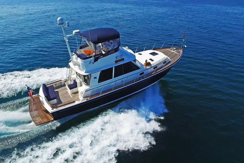 Slide: The Image of 2014 Grand Banks 46 Eastbay FB cruising on open water, showcasing sleek design and performance. - 9