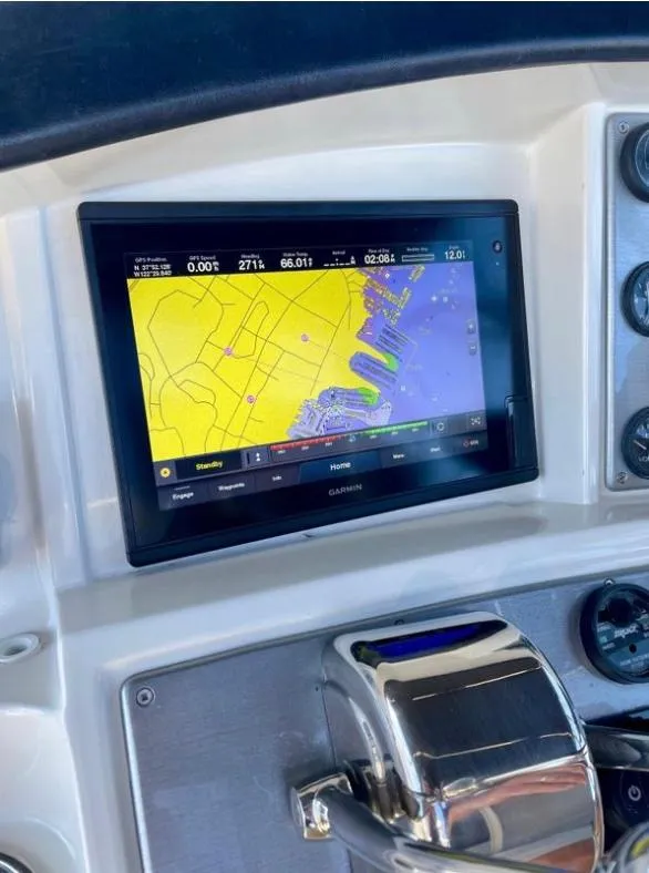 Slide: The Image of 2007 Carver 35 Super Sport dashboard with navigation display and controls. - 13