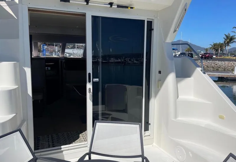 Slide: The Image of 2007 Carver 35 Super Sport yacht with open sliding door, marina view. - 15