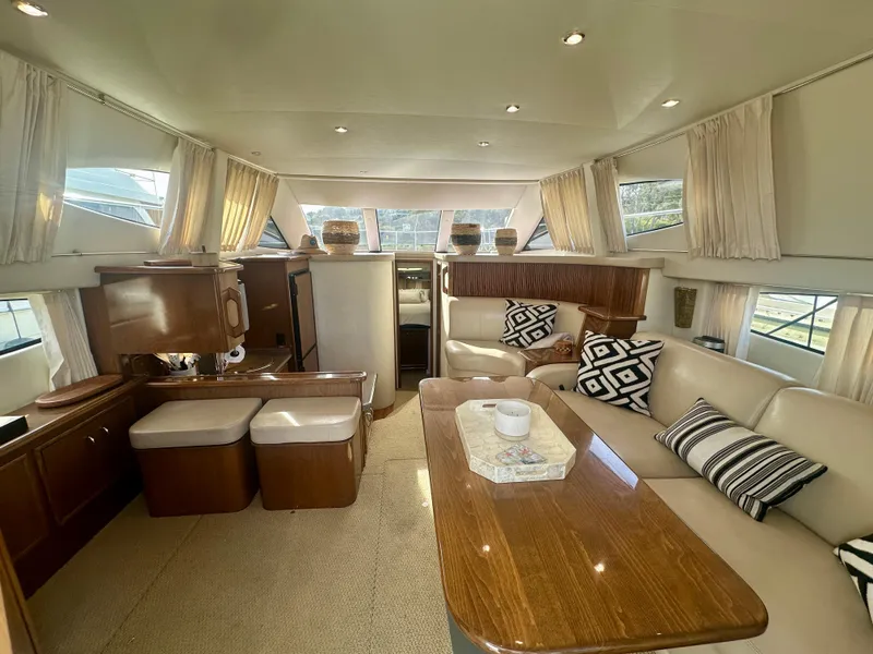 Slide: The Image of Luxurious interior of a 2007 Carver 35 Super Sport yacht with elegant seating and decor. - 16
