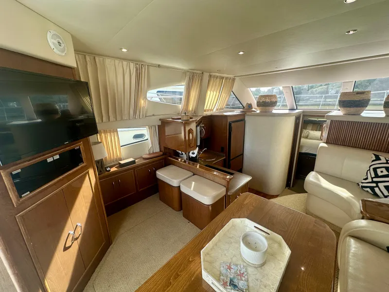 Slide: The Image of Interior of 2007 Carver 35 Super Sport yacht with modern furnishings and natural light. - 17